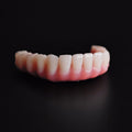 An Acrylic Denture With A Titanium Bar (Ti-Bar) Cost-Effective Full Arch Restoration Screw Retained